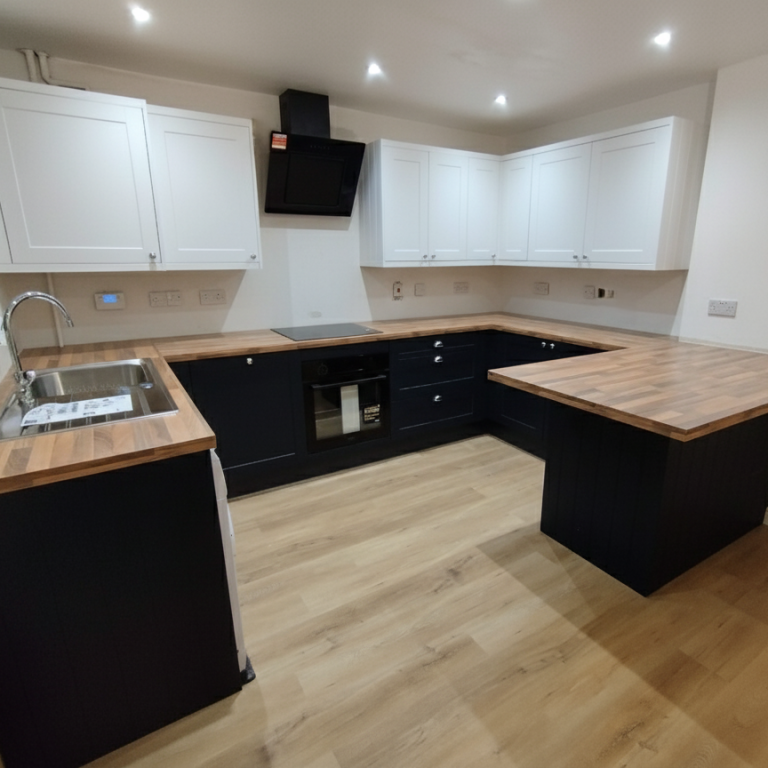 White and blue kitchen Modern kitchen with white cabinets, wooden countertops and wooden flooring.